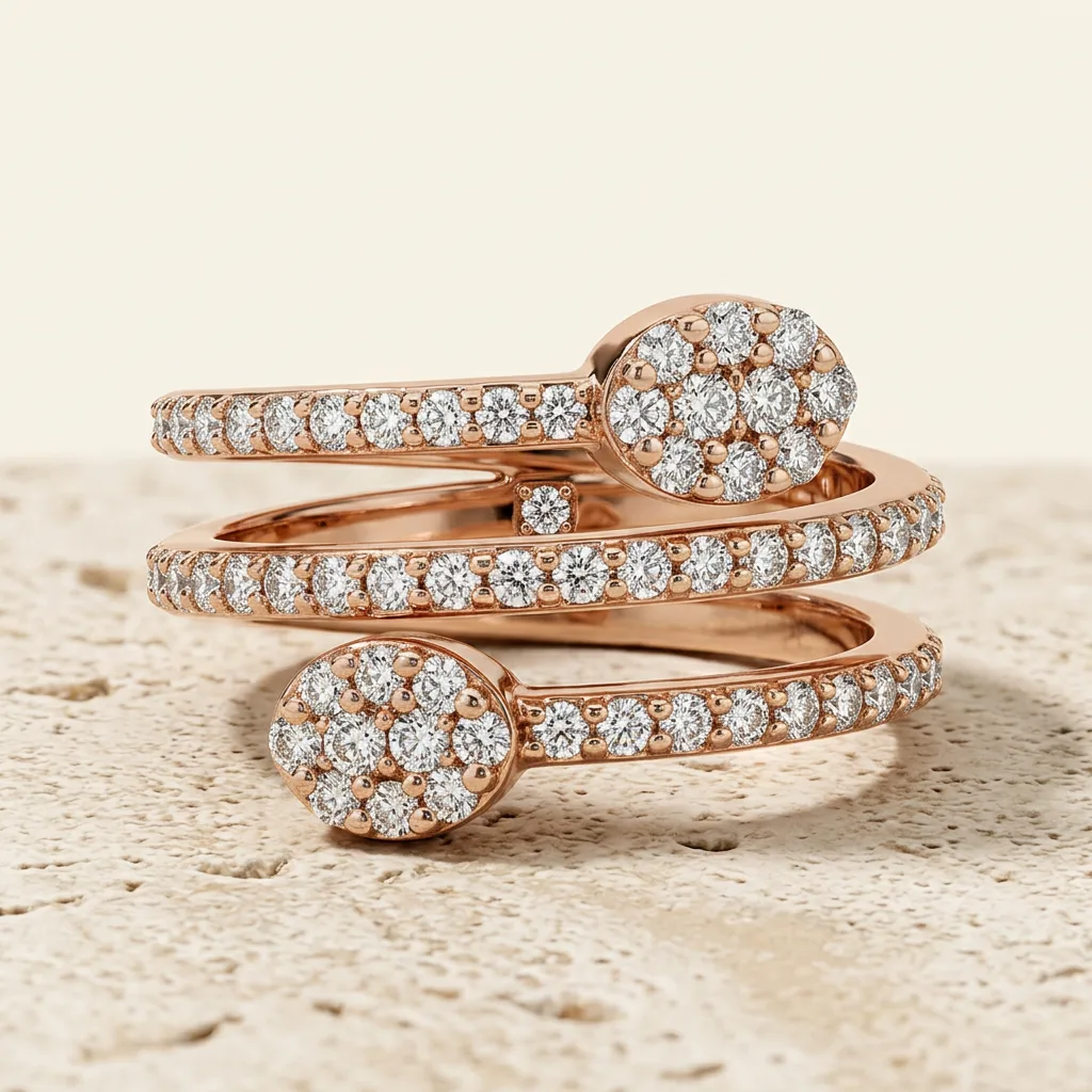 A spiral diamond ring resting on a pale stone surface